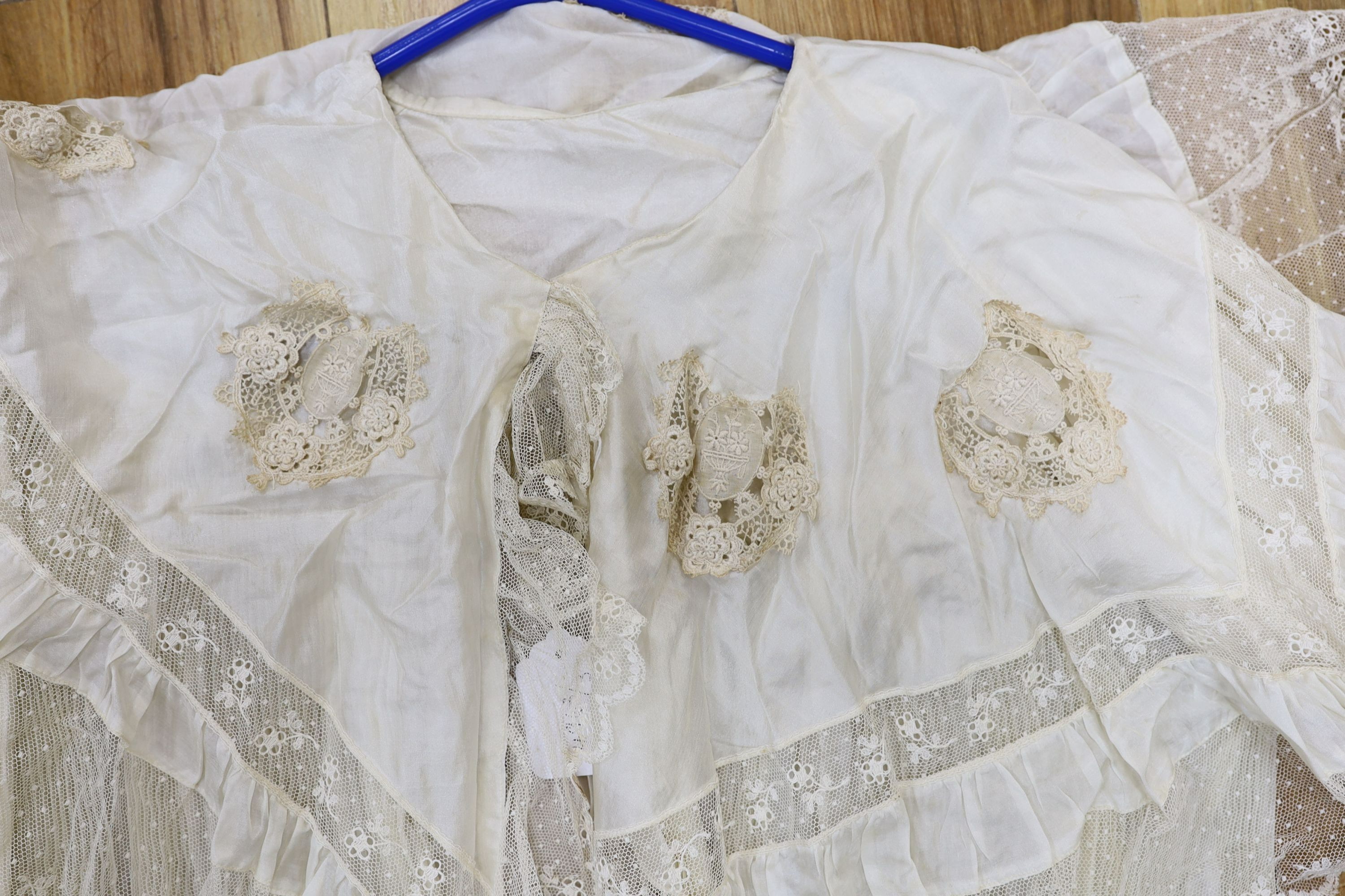 A fine cream silk and lace inserted pleated jacket